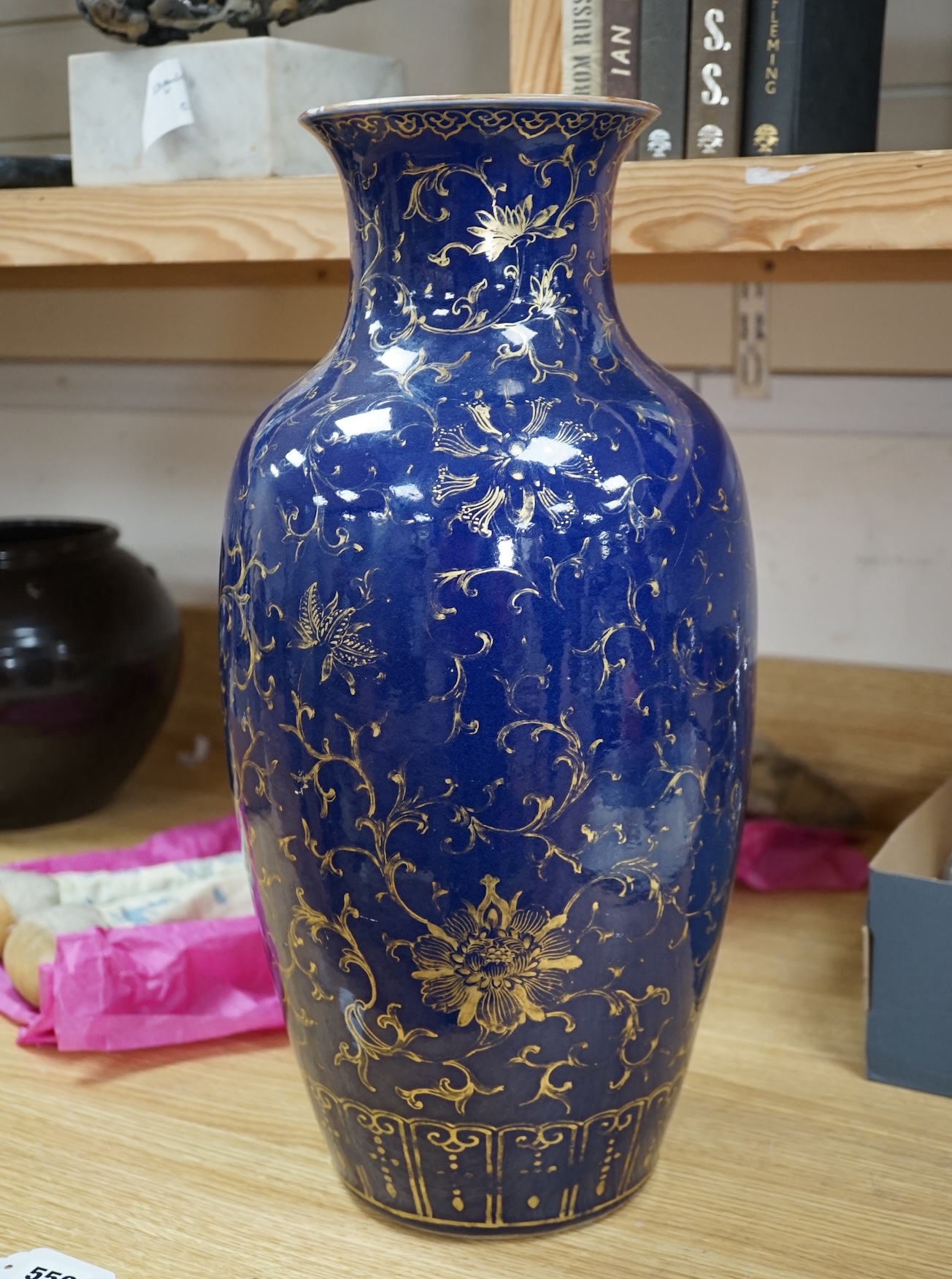 A Chinese gilt decorated blue glazed vase, early 19th century, 48.5cm high. Condition - one side has a large oval break which as been reglued, the gilt decoration is rubbed